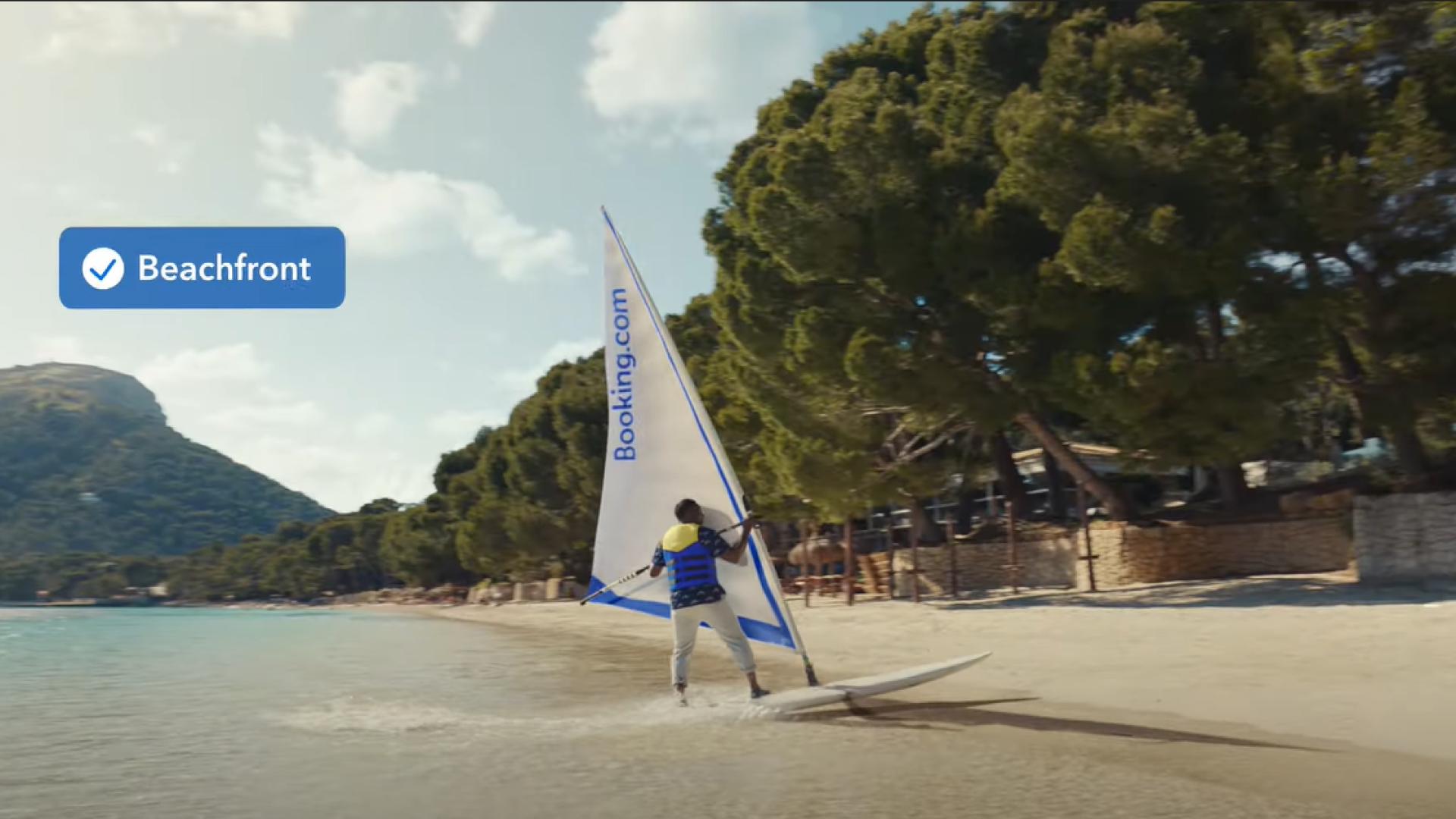 Idris Elba Windsurfs onto a Beach